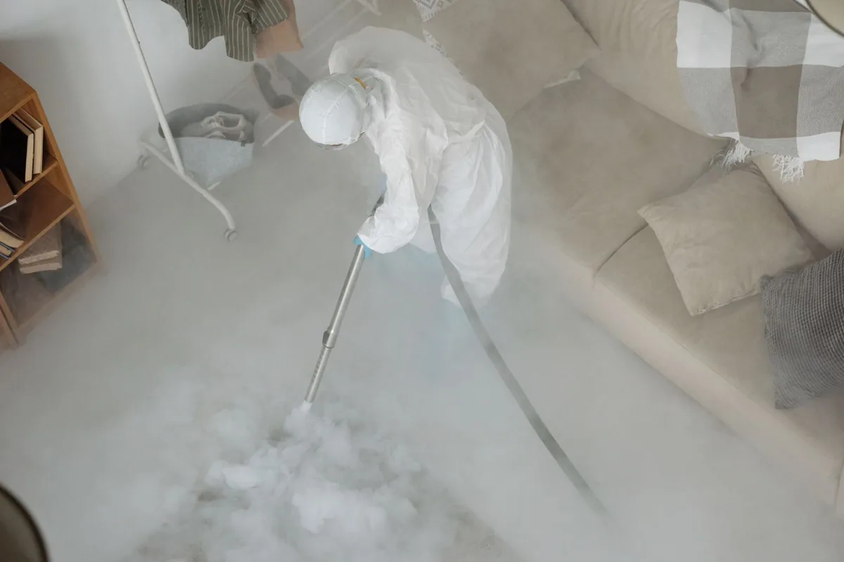 Biohazard cleanup technician in protective equipment, Granby, MA